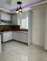 آشپزخانه و کابینت های سفید ویلا دوبلکس 250 متری با نمای سفید در جویبار 3434541521